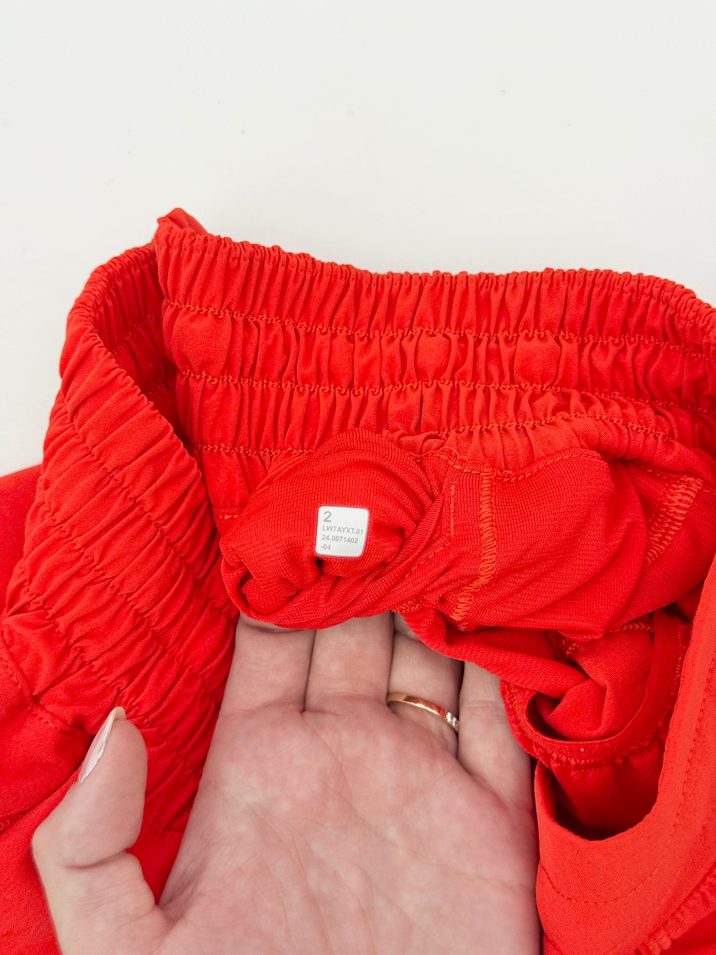 lululemon red high rise hotty hot shorts (size 2, 4" inseam)